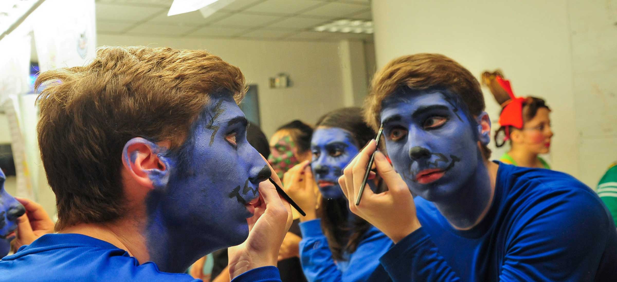 Theater students putting on makeup