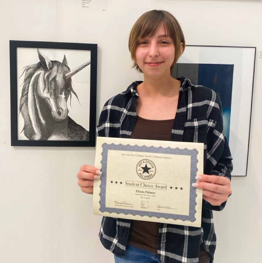Award winner Elissia Palmer with her unicorn drawing titled Marked By The Cross