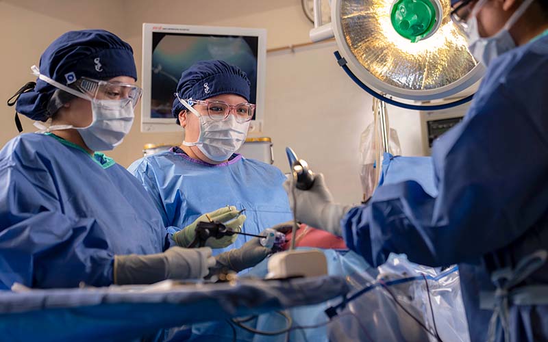 Surgical technology students practicing in classroom